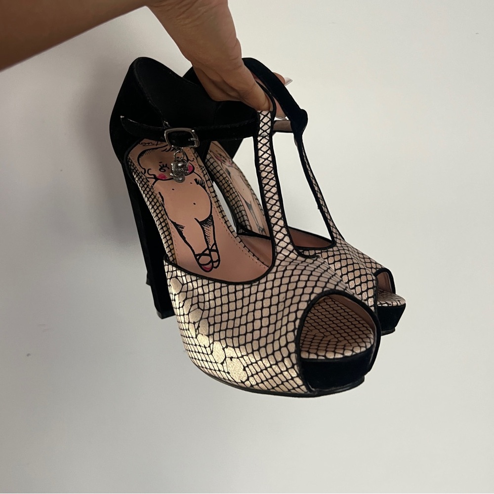Iron fist kewpie platform heels.